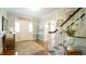 Inviting foyer with hardwood floors, staircase, and neutral decor creating a warm welcome at 1505 Sharnbrook Ct, Raleigh, NC 27614