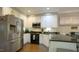 Well-equipped kitchen featuring stainless steel appliances, granite countertops, and ample cabinet space at 1505 Sharnbrook Ct, Raleigh, NC 27614