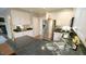 Well-lit kitchen features granite countertops, white cabinetry, stainless steel appliances, and modern fixtures at 1505 Sharnbrook Ct, Raleigh, NC 27614