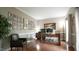 Elegant office space with a large wooden desk, comfortable seating, and decorative wall art at 1505 Sharnbrook Ct, Raleigh, NC 27614