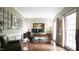 Well-lit office with hardwood floors, desk, and decor offering a stylish and functional workspace at 1505 Sharnbrook Ct, Raleigh, NC 27614