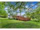 Expansive backyard with a large deck, perfect for outdoor entertaining and enjoying the surrounding greenery at 154 Luther Rd, Raleigh, NC 27610