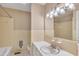Bright bathroom features yellow tiling, and a large sink with ample counter space and an oversized mirror at 154 Luther Rd, Raleigh, NC 27610