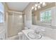 Neat bathroom with a shower, toilet, and a single sink at 154 Luther Rd, Raleigh, NC 27610