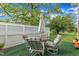 Charming outdoor patio with comfortable seating, ideal for enjoying the serene backyard and relaxing in style at 154 Luther Rd, Raleigh, NC 27610
