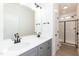 Modern bathroom showcasing double sinks, gray cabinetry and a glass shower at 156 Southern Middle School Rd, Roxboro, NC 27573