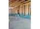 Interior view of a home under construction with exposed wooden framing and concrete floors at 156 Southern Middle School Rd, Roxboro, NC 27573