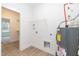 Well-lit laundry room with utility connections, adjacent to walk-in closet at 156 Southern Middle School Rd, Roxboro, NC 27573