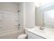 Bathroom features a tub with shower, white cabinets and a vanity at 182 E Victory View Ter, Smithfield, NC 27577