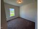 Carpeted bedroom with a window for natural light at 182 E Victory View Ter, Smithfield, NC 27577