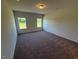 Empty carpeted bedroom with two windows at 182 E Victory View Ter, Smithfield, NC 27577