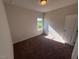 Empty carpeted bedroom with a window at 182 E Victory View Ter, Smithfield, NC 27577