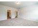 Neutral carpeted bedroom with walk-in closet and ensuite bathroom at 182 E Victory View Ter, Smithfield, NC 27577