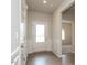 Bright entryway featuring a white front door and wood-look floors, offering a welcoming ambiance at 182 E Victory View Ter, Smithfield, NC 27577
