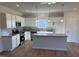 Bright kitchen with granite countertops, stainless appliances and island at 182 E Victory View Ter, Smithfield, NC 27577