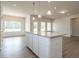 Bright kitchen features granite counters, an island with pendant lights, and wood-look floors at 182 E Victory View Ter, Smithfield, NC 27577