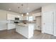 Modern kitchen features white cabinets, granite counters, stainless appliances and an island at 182 E Victory View Ter, Smithfield, NC 27577