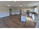 Open floor plan showing island kitchen with granite countertops and stainless appliances at 182 E Victory View Ter, Smithfield, NC 27577