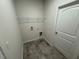 Laundry room with tiled floor and wire rack at 182 E Victory View Ter, Smithfield, NC 27577