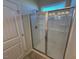 Enclosed shower with glass doors and chrome trim at 182 E Victory View Ter, Smithfield, NC 27577
