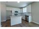Kitchen featuring white cabinets, granite countertops and a stainless steel dishwasher and microwave at 213 Delma Grimes Rd, Coats, NC 27521