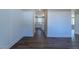 Hardwood floors and wainscoting lead to the kitchen at 213 Delma Grimes Rd, Coats, NC 27521