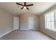 Large primary bedroom featuring vaulted ceiling, neutral paint, carpet, and modern ceiling fan at 213 Delma Grimes Rd, Coats, NC 27521