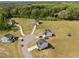 An aerial view showcasing the homes and surrounding greenery at 220 Brisbane Dr, Zebulon, NC 27597