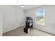 An empty room with a door, a window, neutral walls and carpeting at 220 Brisbane Dr, Zebulon, NC 27597