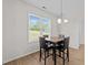 Dining area with a cozy table setting by a bright window, perfect for enjoying meals with a view at 220 Brisbane Dr, Zebulon, NC 27597