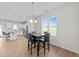 Dining room features a modern table and chairs set beside a bright window with a scenic view at 220 Brisbane Dr, Zebulon, NC 27597