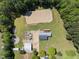 Overhead shot features a sprawling property, including a horse arena and meticulously maintained grounds at 220 Jordan Narron Rd, Selma, NC 27576