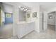 Well-lit bathroom with a white vanity and tiled floors, offering a clean and classic design at 220 Jordan Narron Rd, Selma, NC 27576