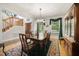 Elegant dining room with a large table, chandelier, and window views, perfect for formal dinners at 220 Jordan Narron Rd, Selma, NC 27576