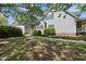 Exterior view of the home with walkway surrounded by lush bushes and manicured lawn at 220 Jordan Narron Rd, Selma, NC 27576