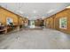 Large garage or workshop area with concrete flooring and ample workspace, perfect for projects and hobbies at 220 Jordan Narron Rd, Selma, NC 27576