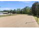 The exterior view showcases the spacious horse arena, ideal for training and equestrian activities at 220 Jordan Narron Rd, Selma, NC 27576