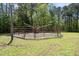 View of the round pen, providing safety for training horses on a lush green lawn at 220 Jordan Narron Rd, Selma, NC 27576