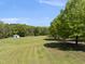 Vast, cleared land with mature trees, offering endless possibilities for development or recreation at 220 Jordan Narron Rd, Selma, NC 27576