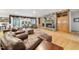 Inviting living room features hardwood floors, stone fireplace, built-in shelves, and sliding glass doors for natural light at 220 Jordan Narron Rd, Selma, NC 27576