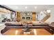 Spacious living room boasts a stone fireplace, hardwood floors, and large windows, perfect for entertaining guests at 220 Jordan Narron Rd, Selma, NC 27576