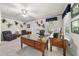This home office is flooded with natural light, has a ceiling fan, and plenty of room to work at 220 Jordan Narron Rd, Selma, NC 27576
