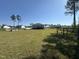 Expansive backyard features a well-maintained lawn and surrounding greenery at 226 Kandypoo Dr, Four Oaks, NC 27524
