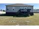 Exterior of home shows deck with steps in the backyard at 226 Kandypoo Dr, Four Oaks, NC 27524