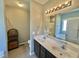 Bright bathroom featuring double sinks, updated fixtures, and plenty of storage space at 226 Kandypoo Dr, Four Oaks, NC 27524