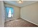 Bedroom with plush carpet and a window with blue curtains at 226 Kandypoo Dr, Four Oaks, NC 27524