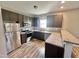 Well-lit kitchen with stainless steel appliances, laminate countertops, and ample cabinet space at 226 Kandypoo Dr, Four Oaks, NC 27524