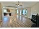 Inviting living room featuring vaulted ceilings, wood-look floors, a fireplace, and bright natural light at 226 Kandypoo Dr, Four Oaks, NC 27524