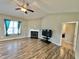 Cozy living room featuring a fireplace, and plenty of natural light, creating a warm and inviting atmosphere at 226 Kandypoo Dr, Four Oaks, NC 27524