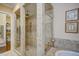 Spacious bathroom featuring a walk-in shower with multiple shower heads and a tile surround at 2307 Carriage Oaks Dr, Raleigh, NC 27614